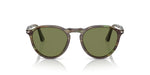 Sunglasses with green lenses and tortoise frame on a white background