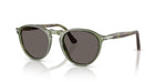 Green sunglasses with dark lenses on a white background