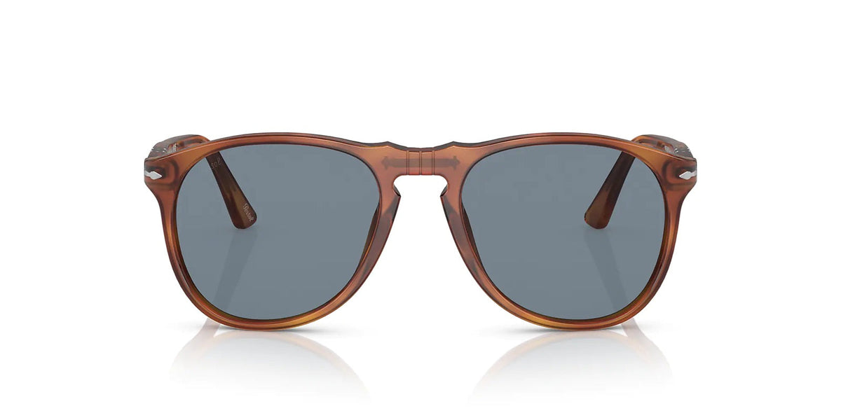 Brown sunglasses with dark lenses on a white background