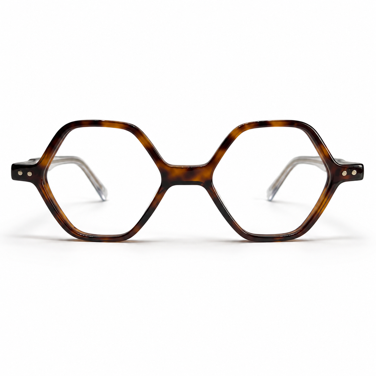 Tortoiseshell eyeglasses with clear accents on a white background