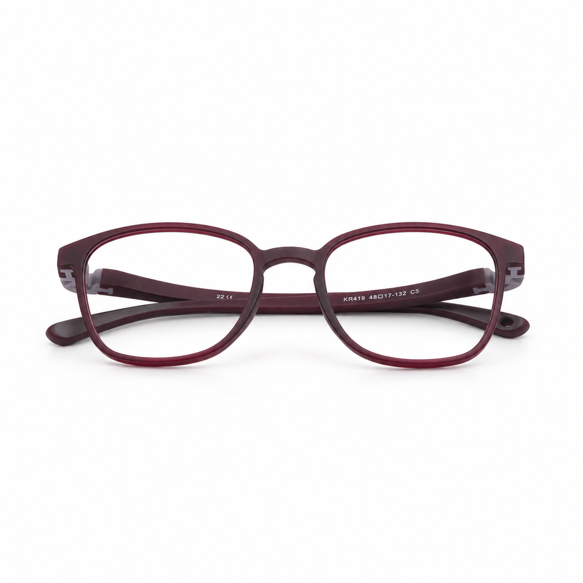 Pair of maroon eyeglasses on a white background