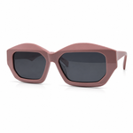 Sunglasses with a pink frame and dark lenses on a white background