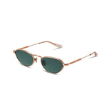 gold sunglasses with green lenses on a white background