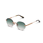 Rimless sunglasses with gold frame and green gradient lenses on a white background