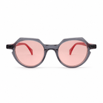 Sunglasses with pink lenses and black frames on a white background