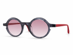 Sunglasses with round frame, pink lenses, and red accents on a white background