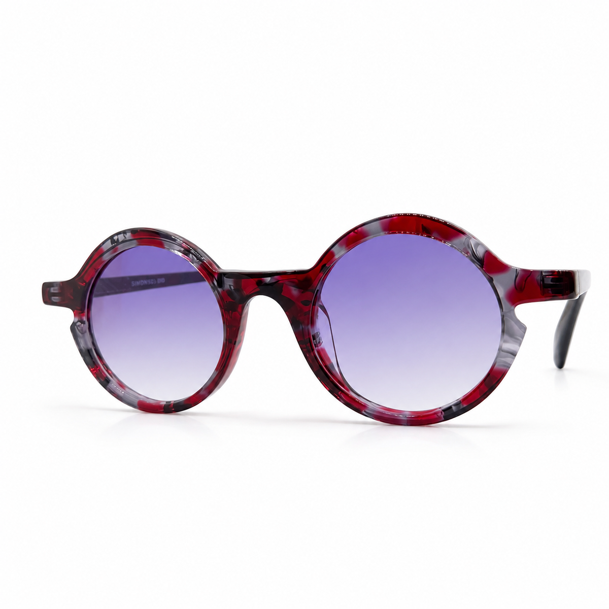 Round sunglasses with a red and black pattern on a white background