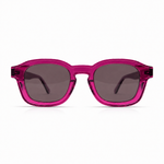 Pink sunglasses with dark lenses on a white background