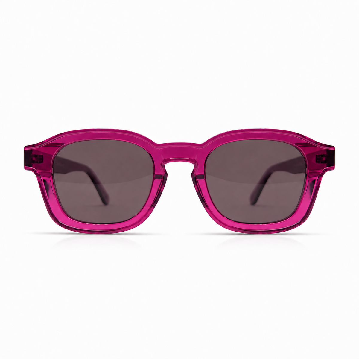 Pink sunglasses with dark lenses on a white background