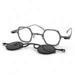 Eyeglasses with detachable clip on a white background