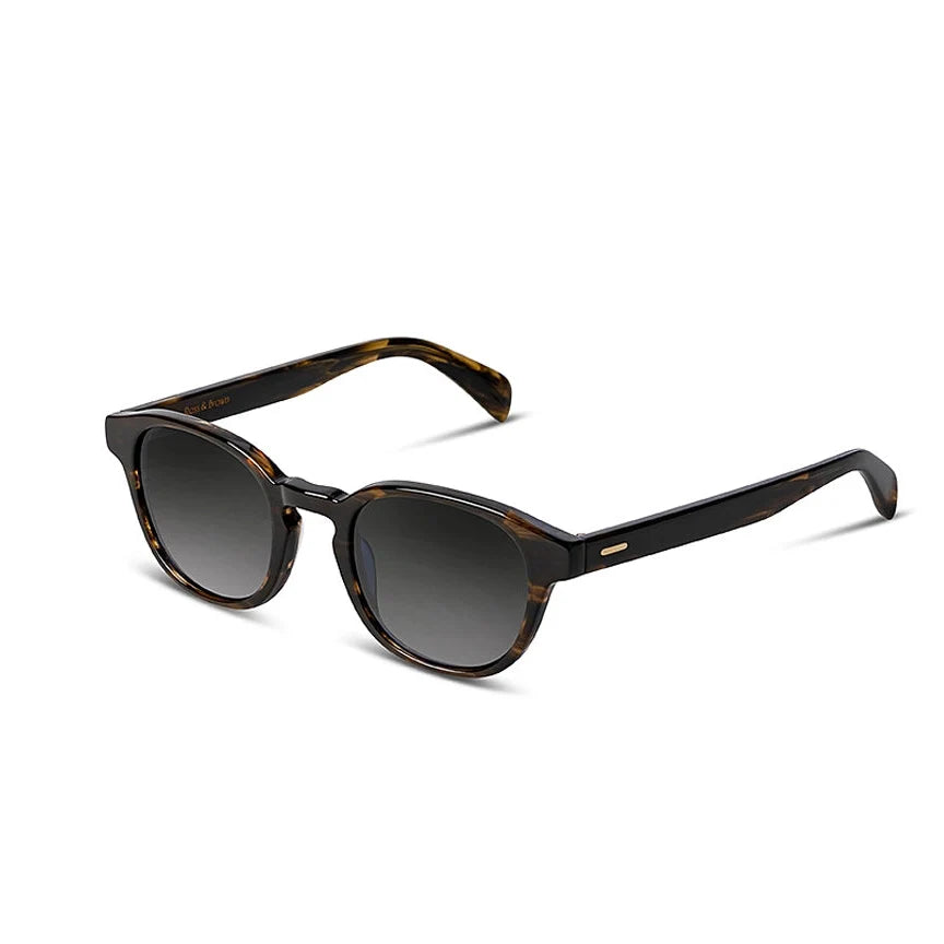 Sunglasses with dark tortoiseshell frame and gradient lenses on a white background