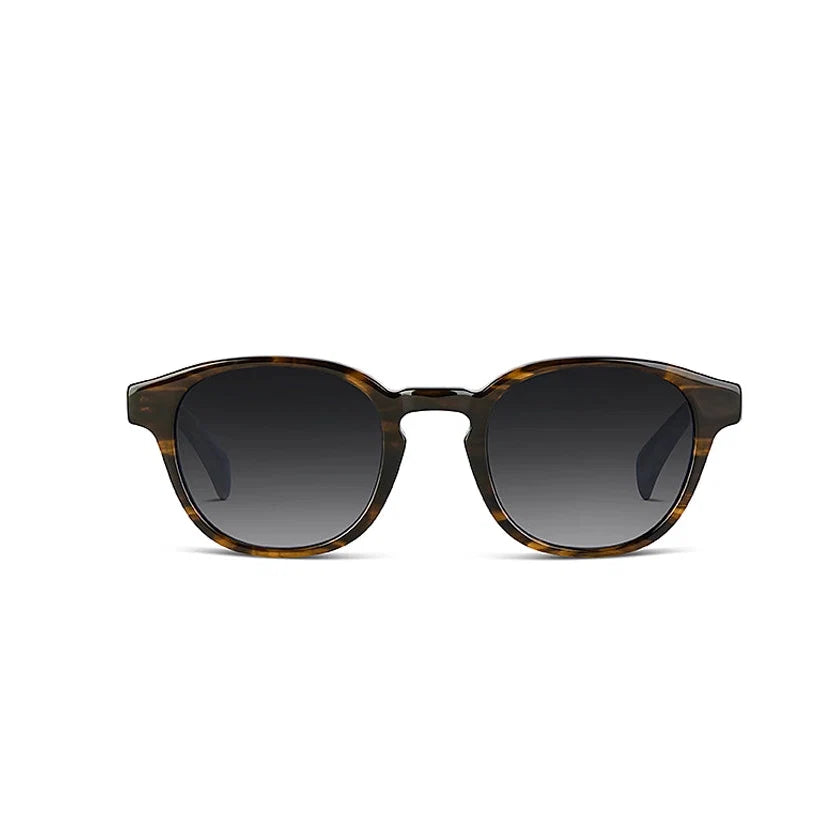 Sunglasses with havana frame and dark lenses on a white background
