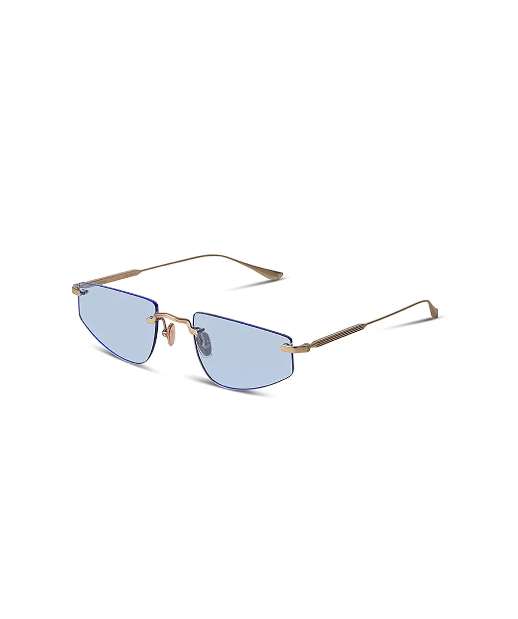 Side angle of gold framed sunglasses with blue lenses on a white background. 