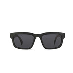 Black sunglasses with dark lenses on a white background