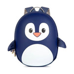 A penguin-shaped backpack in navy blue and white with a small orange beak, photographed on a clean white background.