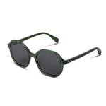 Green sunglasses with dark lenses on a white background