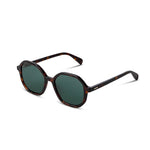 Sunglasses with tortoiseshell frame and dark lenses on a white background