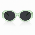 Sunglasses with a translucent mint green frame and dark gray lenses, shown against a white background with a soft reflection below.