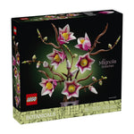 LEGO Botanicals Magnolia Branches building set box, featuring pink and white magnolia flowers with yellow centers on brown branches against a black background, with LEGO and Botanicals branding on the front and side.