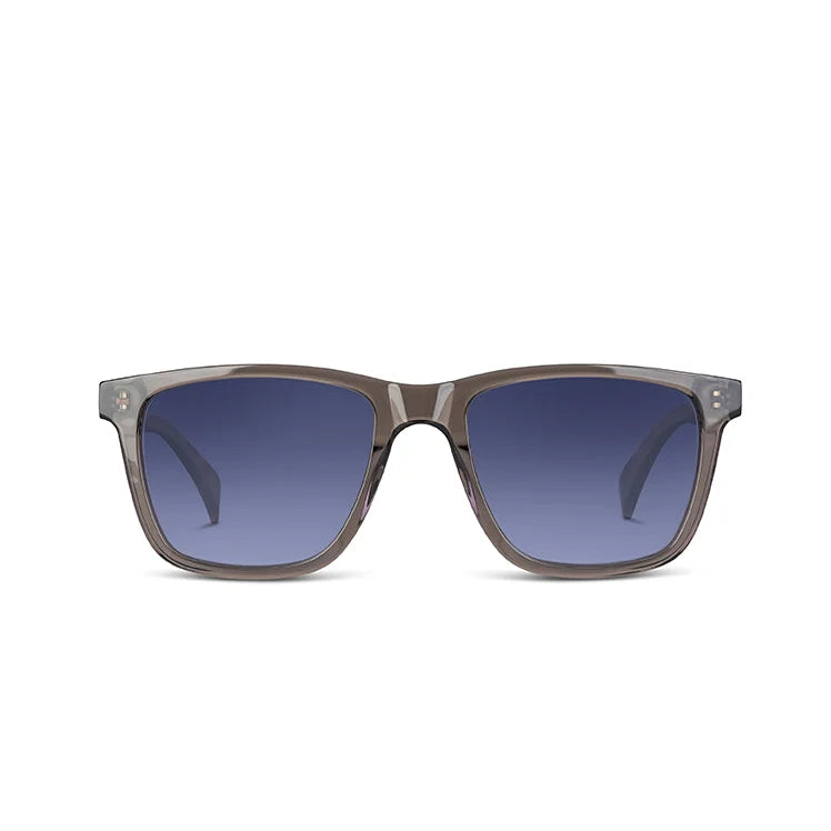 A pair of square sunglasses with a translucent gray acetate frame and blue gradient lenses, shown against a plain white background.