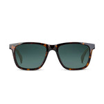 Front angle of dark havana framed eyeglasses with green lenses on a white background