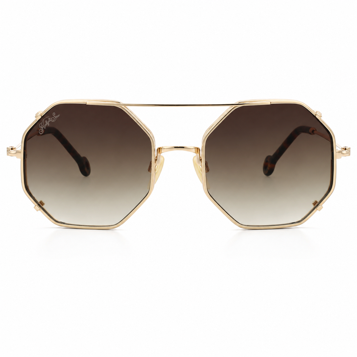 Hexagonal aviator-style sunglasses with a gold metal frame and gradient brown lenses, shown against a plain white background.