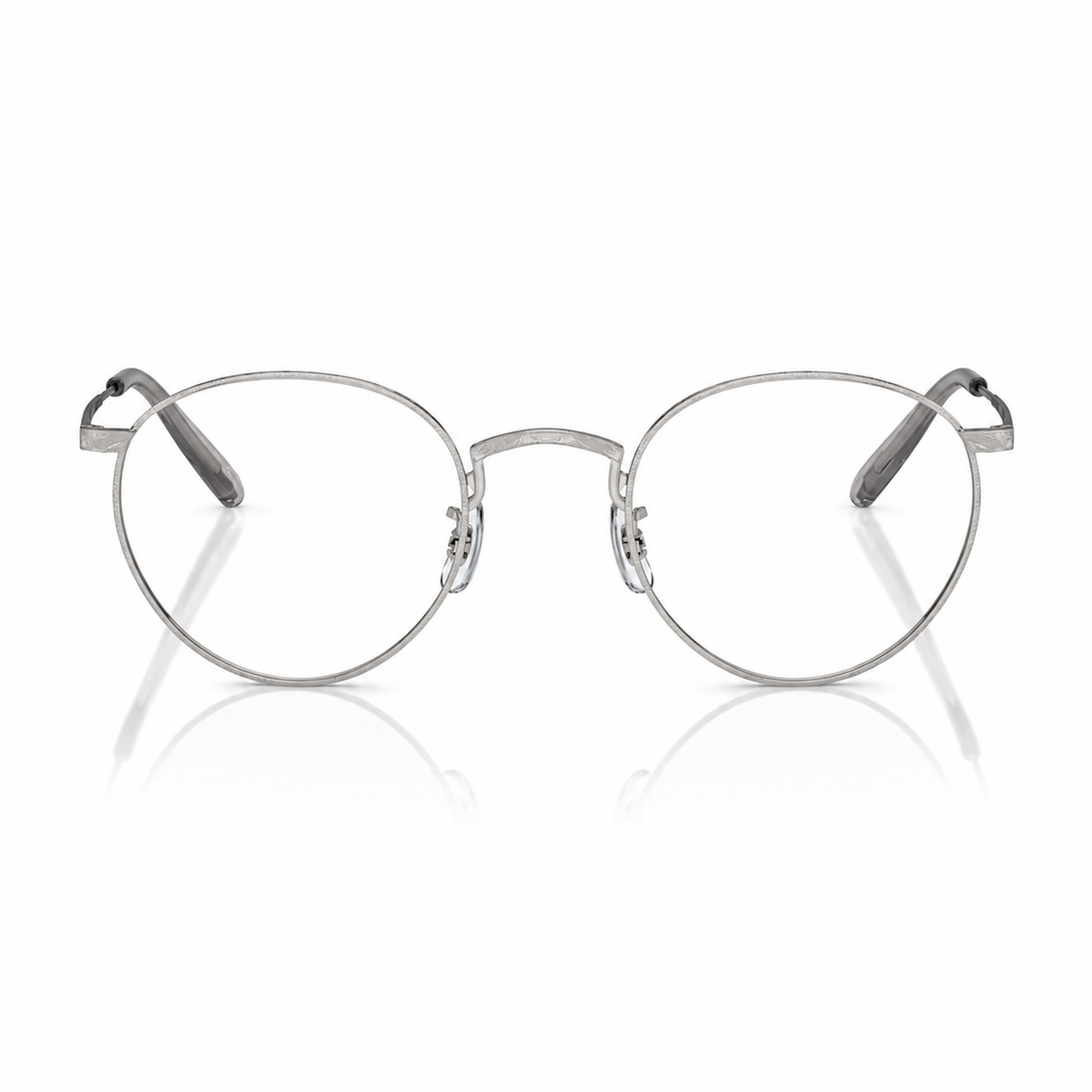 Round metal eyeglasses with a thin silver frame and clear lenses, displayed on a clean white background with a soft reflection below.