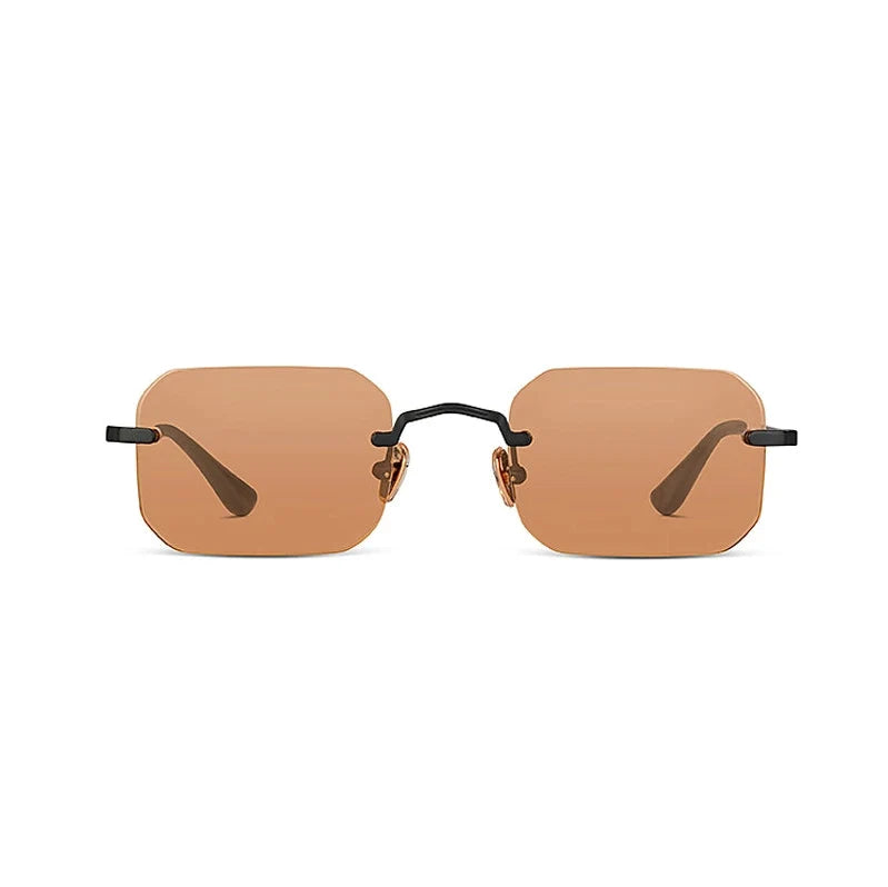 Sunglasses with a tan frame and dark lenses on a white background