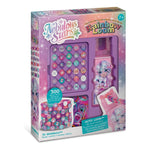 Nebulous Stars Rainbow Loom toy kit in its original retail packaging, featuring a purple loom board with colorful thread spools, a character stamp, and accessories.
