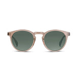 Round sunglasses with a translucent blush pink frame and dark green lenses, shown from the front on a plain white background.