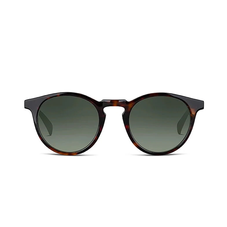 Round sunglasses with tortoise frame and green lenses on a white background. 