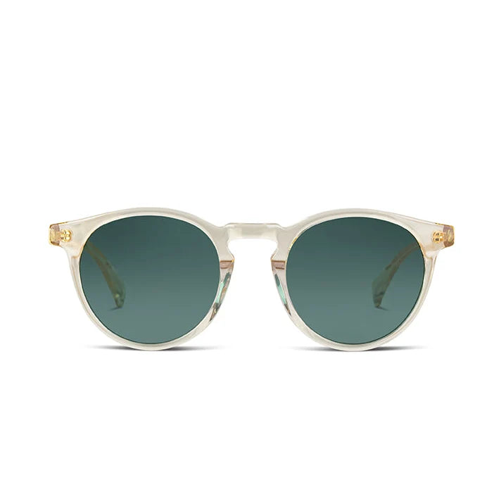 Round sunglasses with translucent off-white frames and dark green lenses, shown against a plain white background.