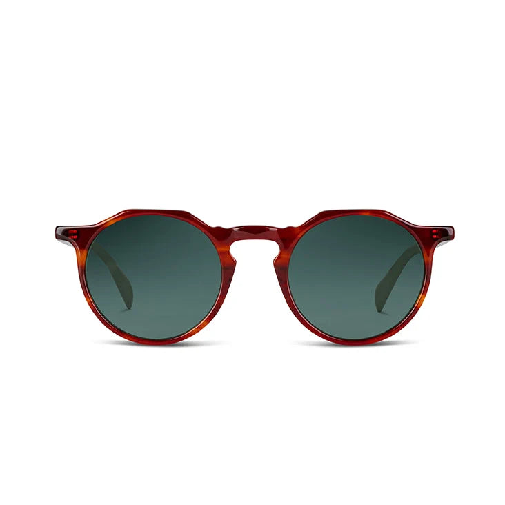 Front angle of dark havana frames with green lenses on a white background.