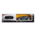 A boxed remote control toy car displayed in its retail packaging. The package contains a black remote control car with bright blue accents, visible through a clear window on a black and white box with a checkered flag design.