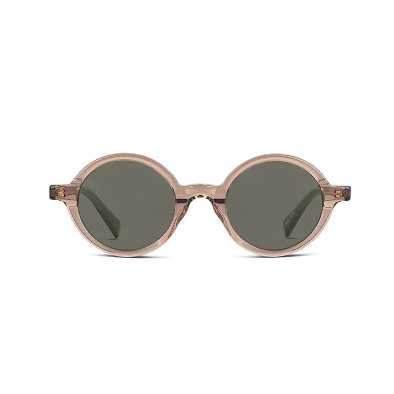 Oval sunglasses with translucent champagne colored frames and dark green lenses, shown against a plain white background.