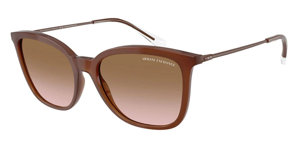 Brown cat-eye glasses on a white background. 