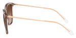 Side angle of light brown cat-eye glasses on a white background. 