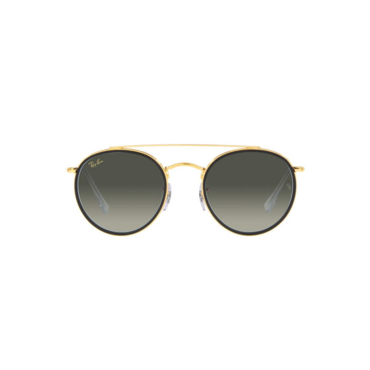Round sunglasses with gold frame and dark lenses 