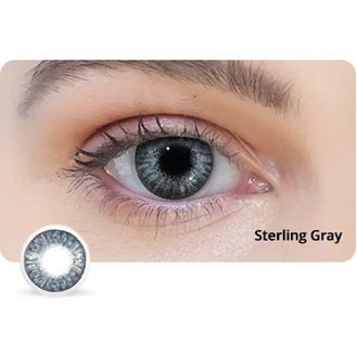 Close-up of an eye wearing Sterling Gray contact lenses with a lens displayed below.