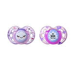Two Tommee Tippee Night Time orthodontic soothers for toddlers 18-36 months in assorted understated designs.