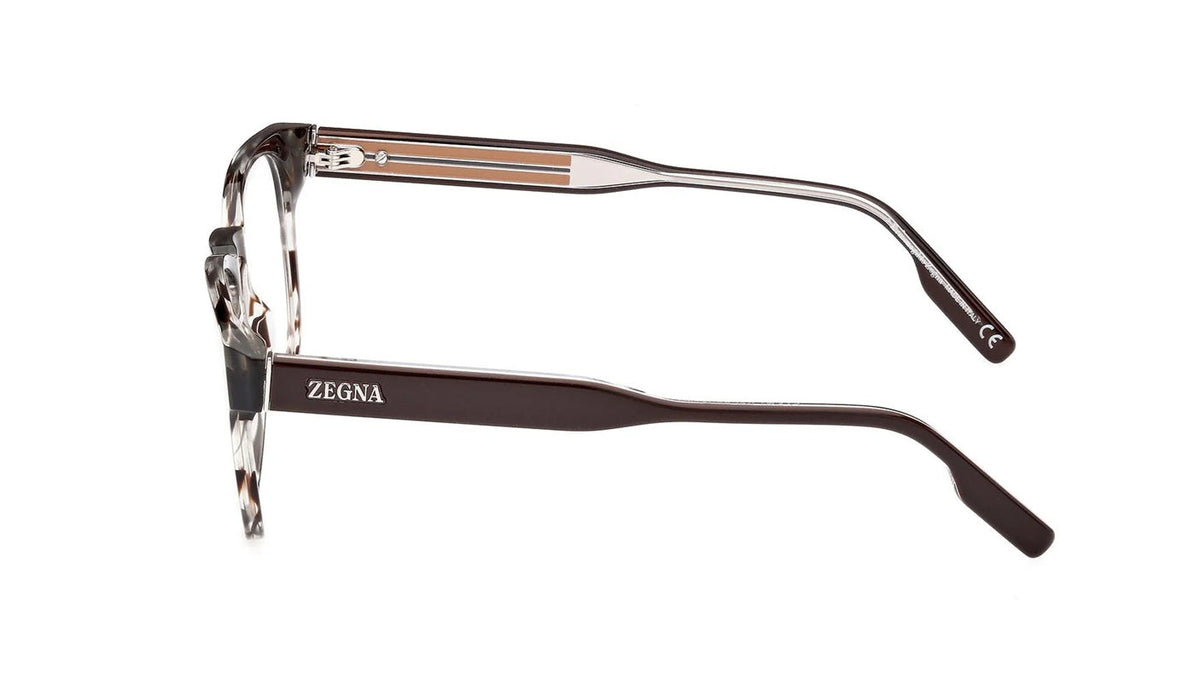 Side angle of havana-framed eyeglasses on a white background. 