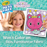 Girl using Crayola Gabby's Dollhouse mess-free coloring set, showing clean hand.