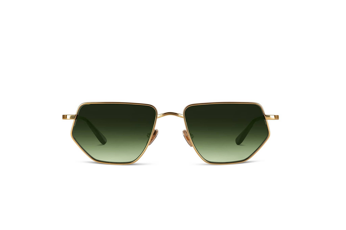 Sunglasses with gold frame and green gradient lenses on a white background
